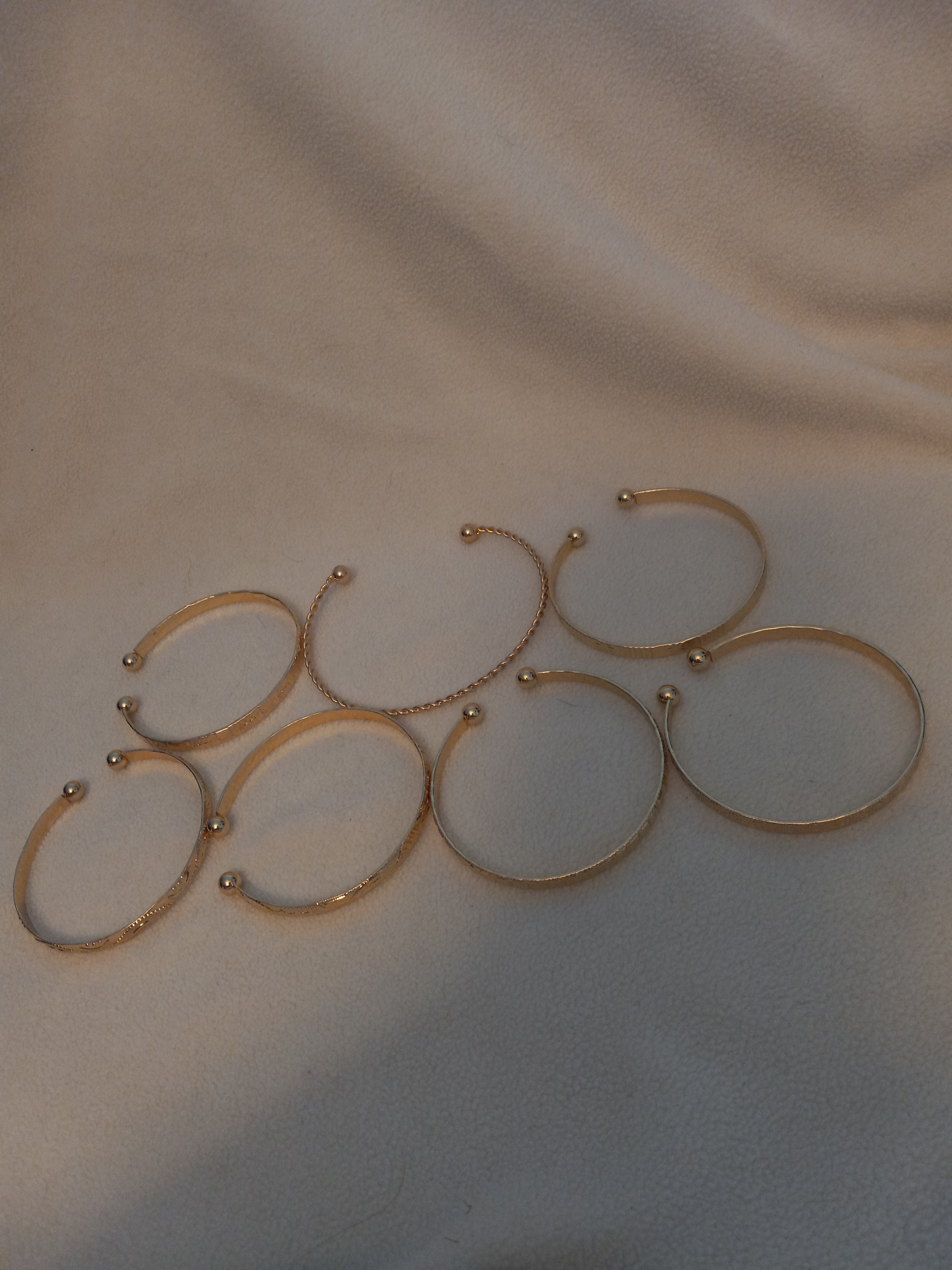 J 29 Set of 7 Gold Bracelets