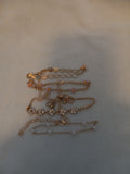 J 33  Set of 4 Gold Bracelets