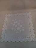 L 9  White 5 1/2 inch Hand Cut Plastic Doilies