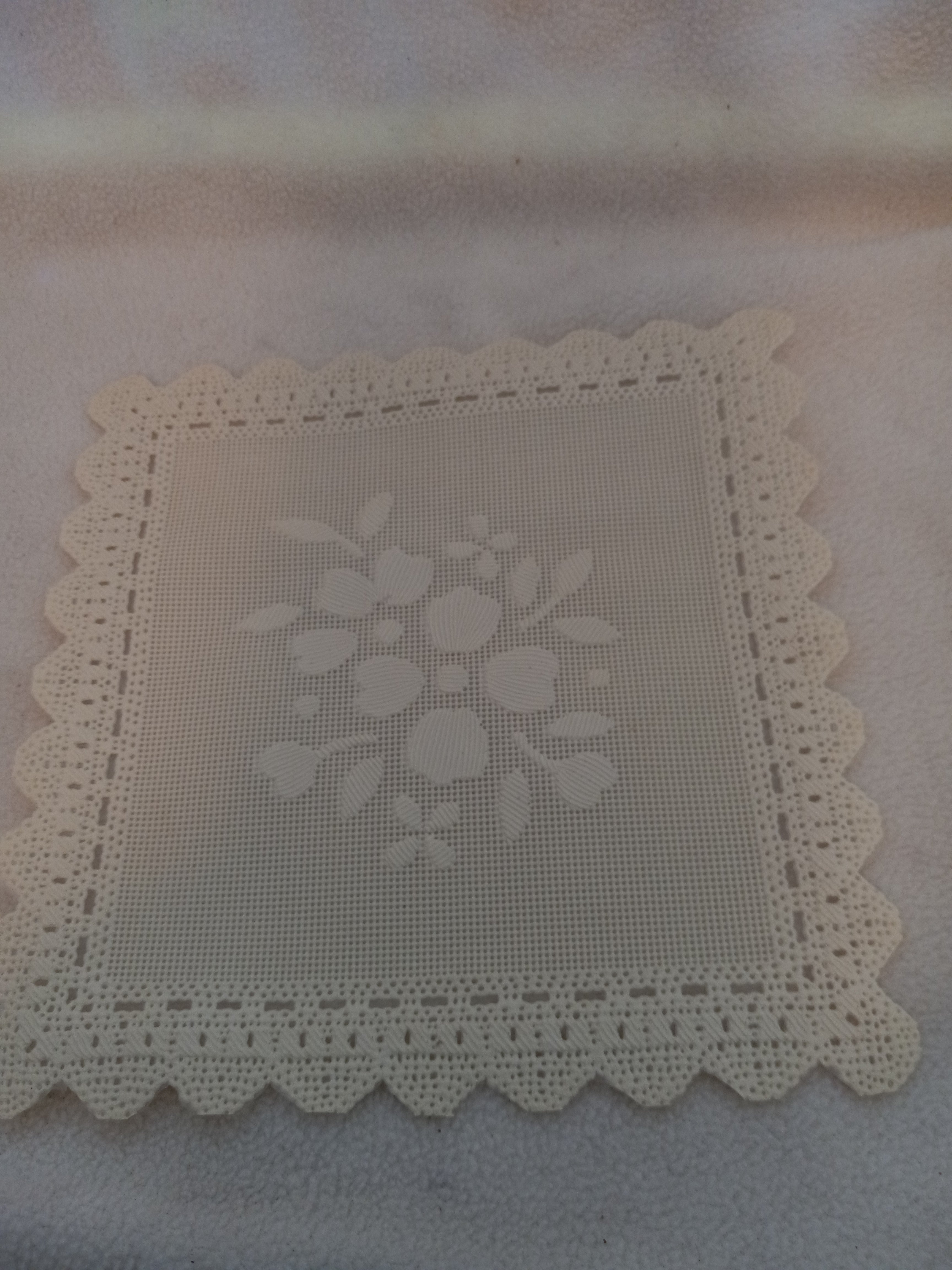 L 11  Ecru 5 1/2 inch Hand Cut Plastic Doilies