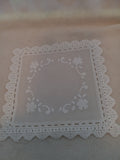 L 10  Plastic 5 1/2 inch Doilies
