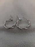 J 231  Silver 1 inch Loose Swirl Earrings